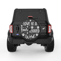 LOVE IS A FOUR LEGGED WORD BLACK TIRE COVER